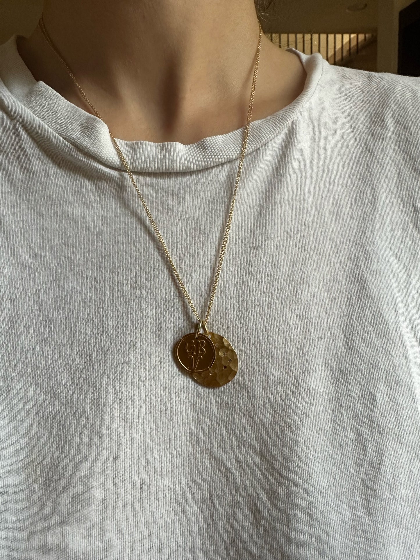 Kaja Erika Jorgensen 18k yellow gold coin charm and Stars Colliding Charm