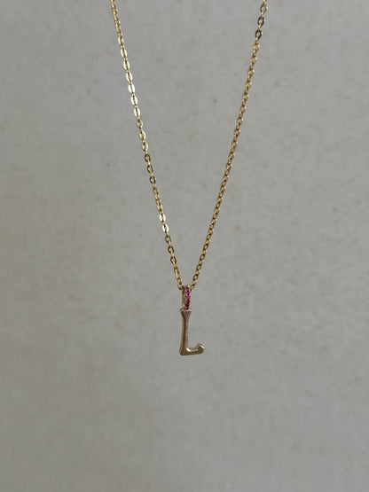 L charm with rubies 